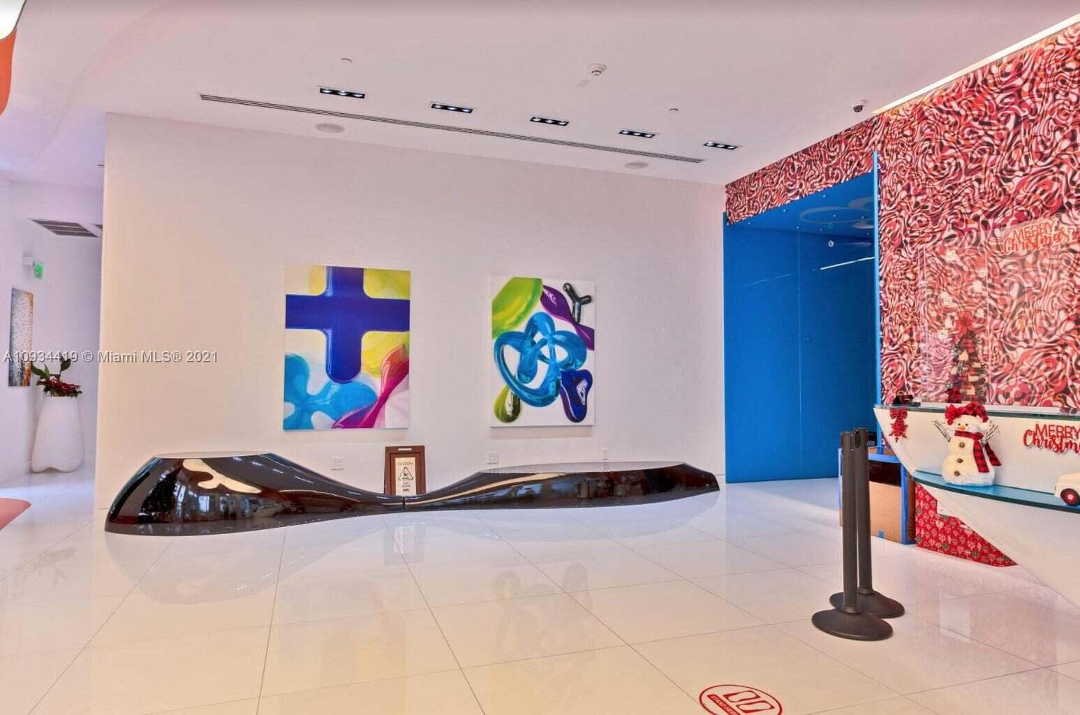 31 Southeast 6th Street, Unit 602 Miami, FL 33131 - Photo 35 of 39 a view of a sink with dishwasher and refrigerator