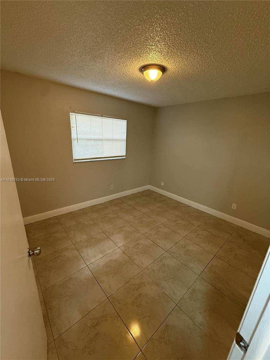 4121 Stirling Road, Unit 402 Dania Beach, FL 33314 - Photo 8 of 10 a view of empty room