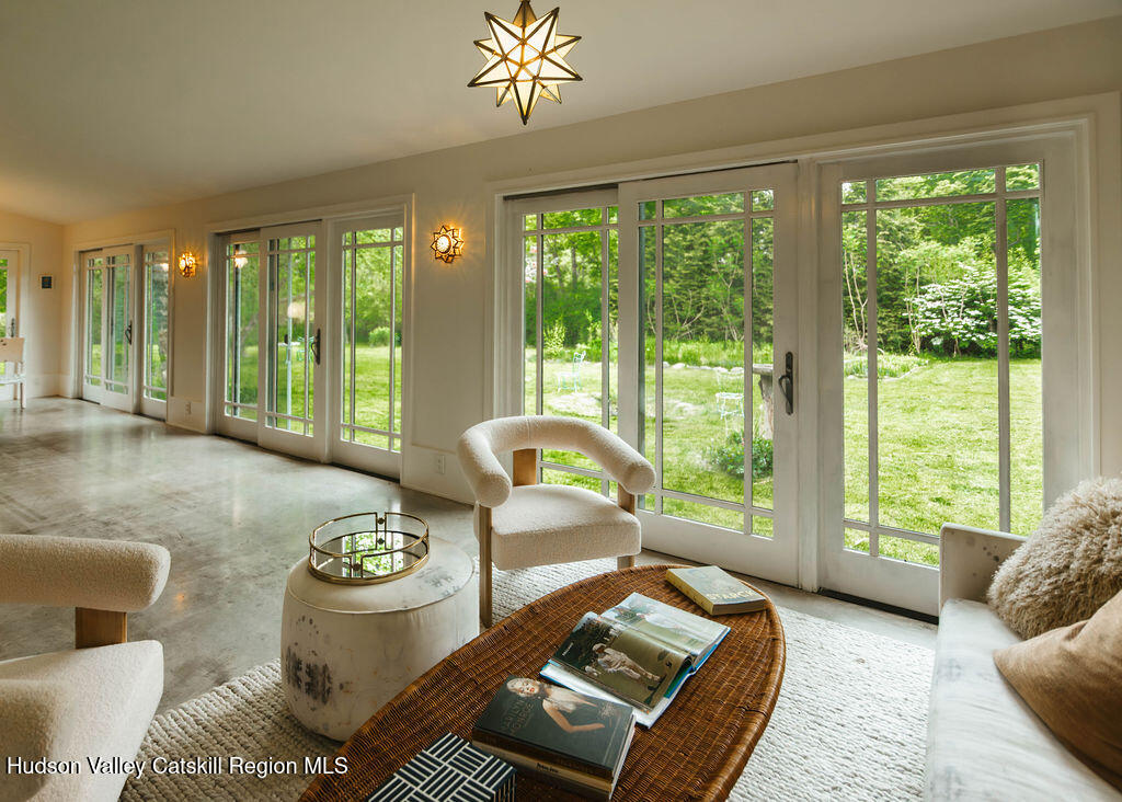 675 Cooper Lake Road Woodstock, NY 12448 - Photo 24 of 31 a living room with furniture and a large window