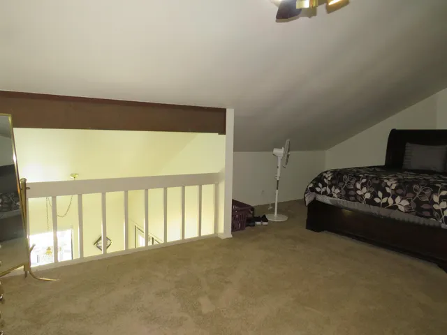 a bathroom with a toilet and a shower curtain