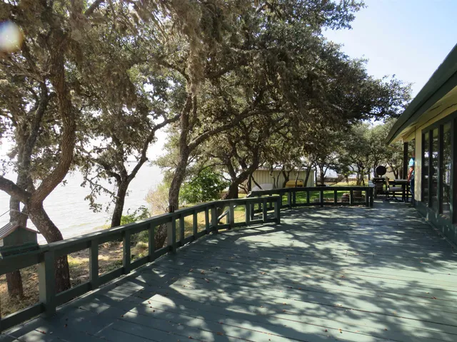 a view of swimming pool from a lake view