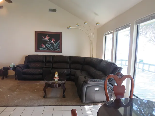 a view of staircase with wooden floor and white walls