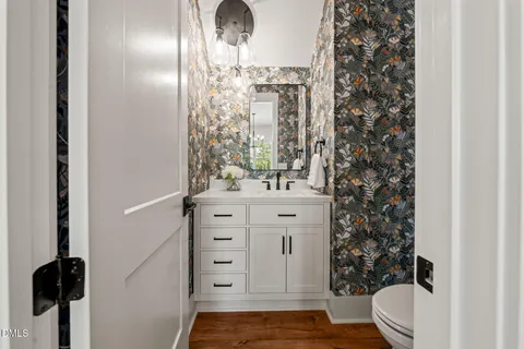 a bathroom with a toilet and a shower curtain