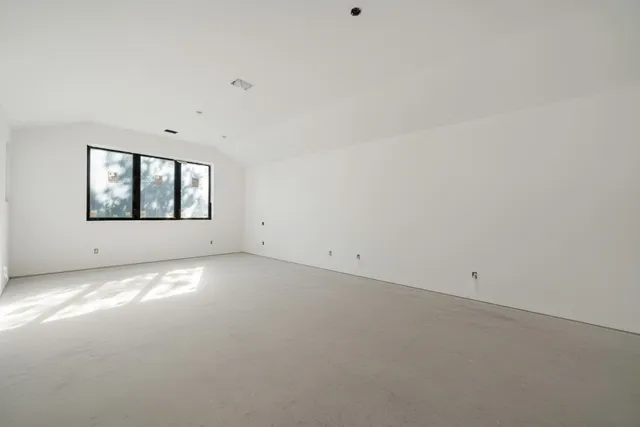 a view of a room with window and air conditioner in it