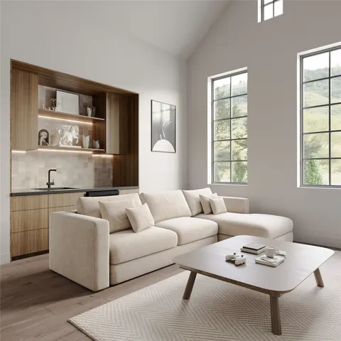 a living room with furniture and windows