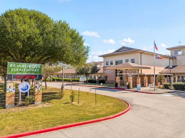 a swimming pool with outdoor seating and yard