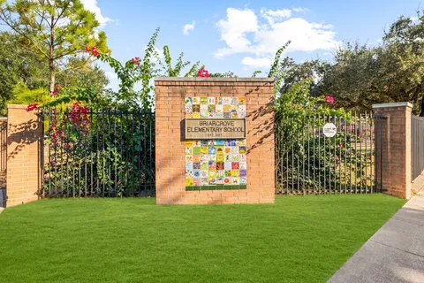 a view of an house with backyard space and garden