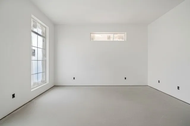 an empty room with windows