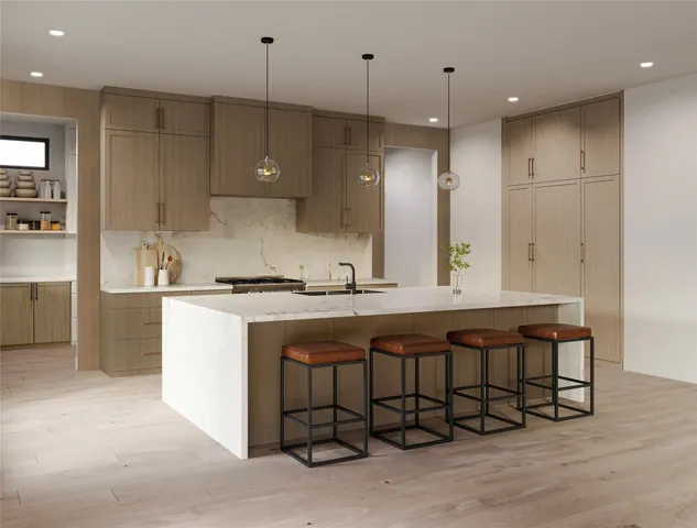 a kitchen with a sink and refrigerator