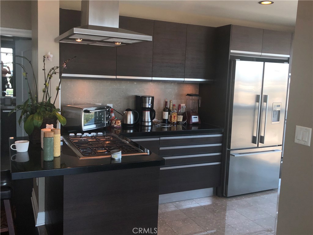 401 Rockefeller Irvine, CA 92612 - Photo 2 of 8 a room with lots of bottles of alcohol