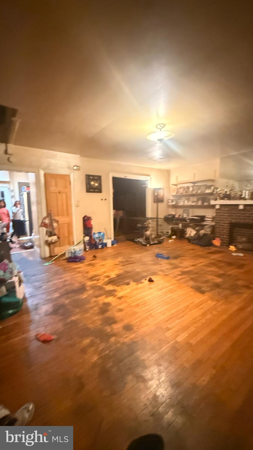 1322 South 57th Street Philadelphia, PA 19143 - Photo 4 of 9 Spacious room with warm wooden floors.