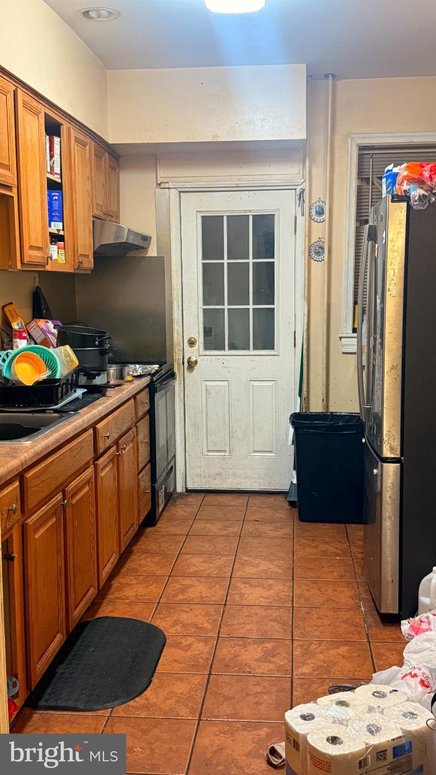 1322 South 57th Street Philadelphia, PA 19143 - Photo 6 of 9 Cozy kitchen with warm wooden accents.