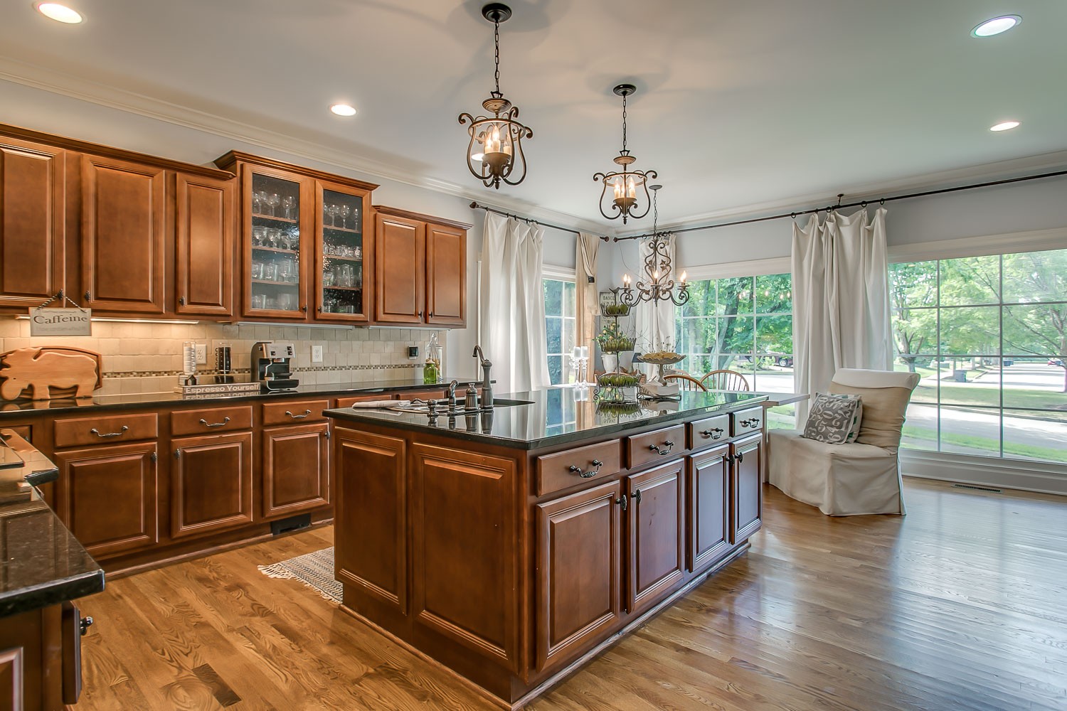 128 Deejay Drive Franklin, TN 37064 - Photo 26 of 50 a kitchen with stainless steel appliances granite countertop stove top oven and cabinets
