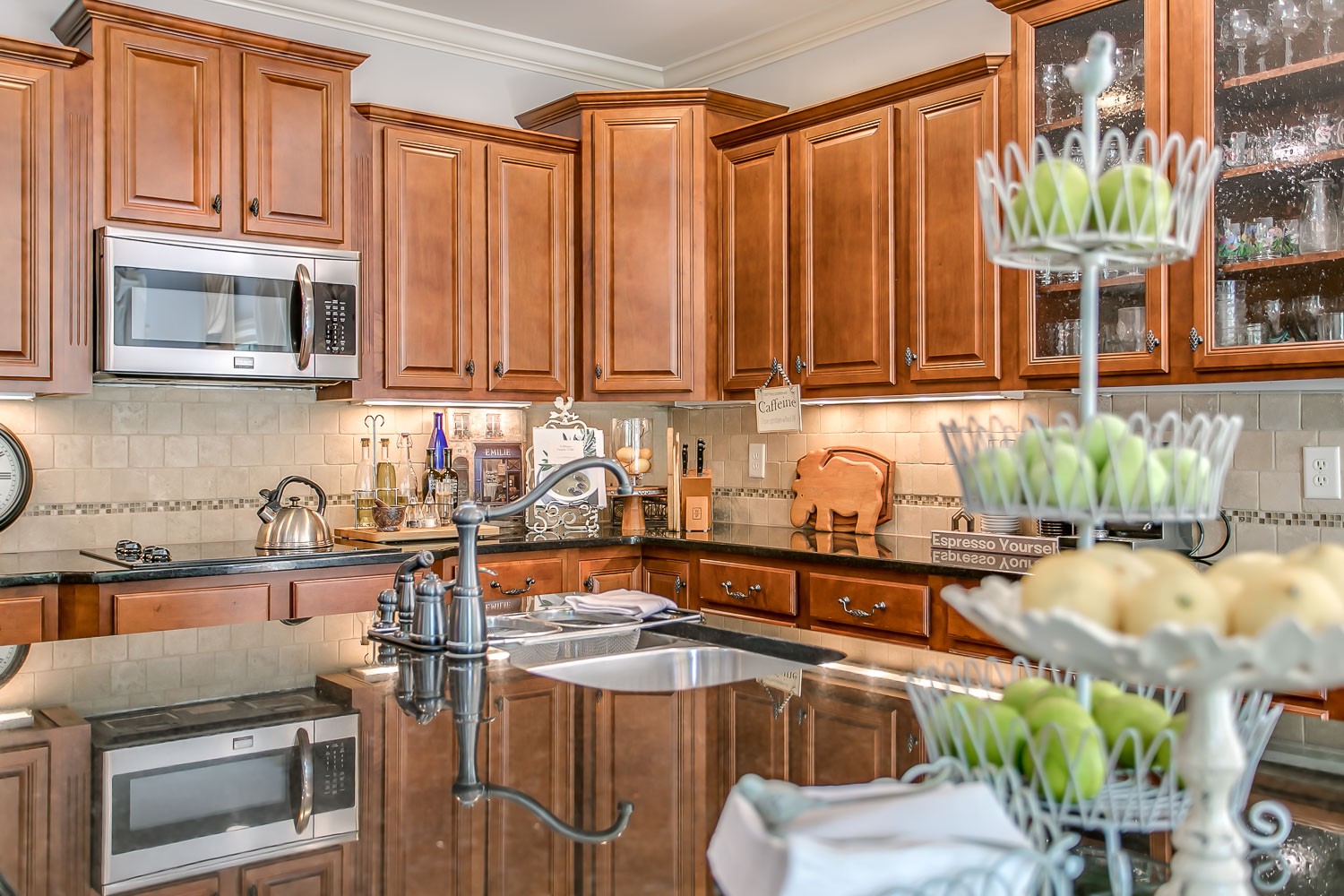 128 Deejay Drive Franklin, TN 37064 - Photo 29 of 50 a kitchen with stainless steel appliances granite countertop a stove a sink and a microwave