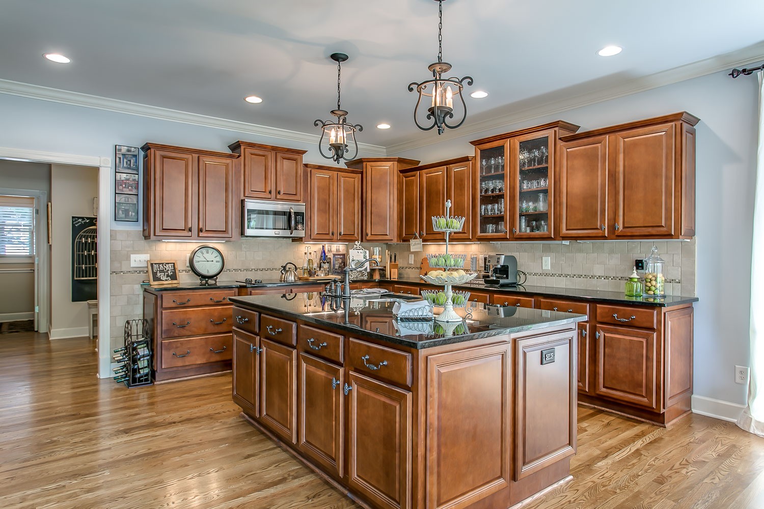 128 Deejay Drive Franklin, TN 37064 - Photo 30 of 50 a kitchen with stainless steel appliances granite countertop wooden cabinets stove a sink and dishwasher
