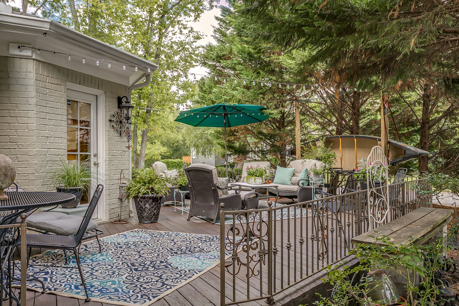 128 Deejay Drive Franklin, TN 37064 - Photo 47 of 50 a view of a patio with table and chairs and potted plants