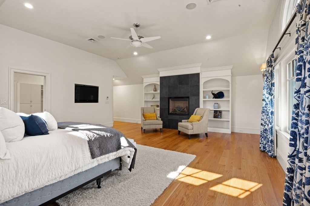 204 Cedar Street Lexington, MA 02421 - Photo 23 of 42 a bedroom with a bed couch and a window