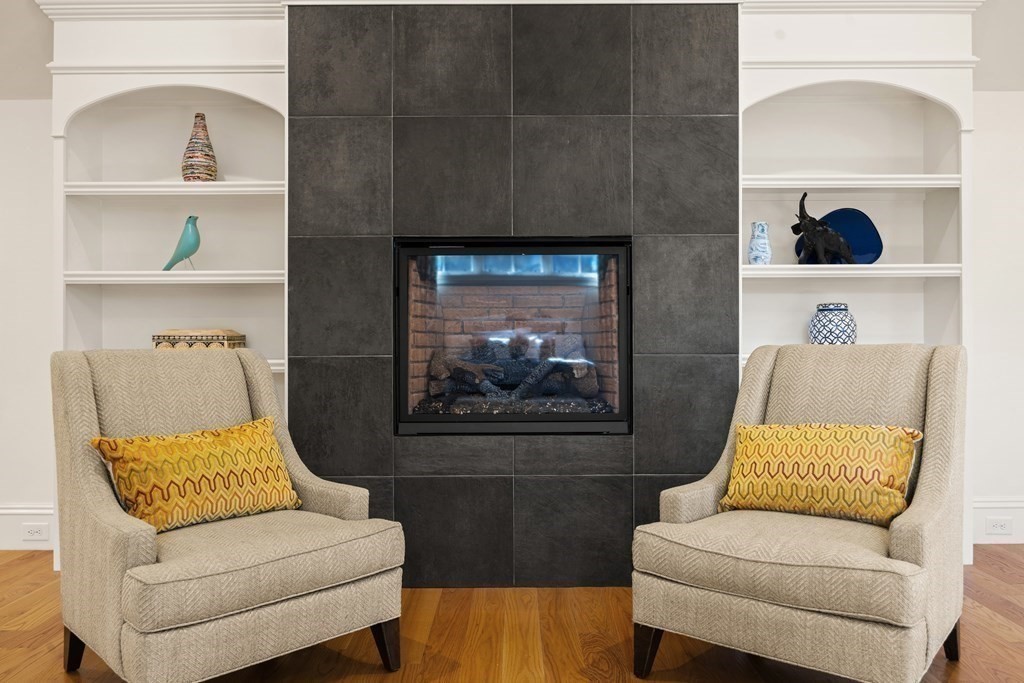 204 Cedar Street Lexington, MA 02421 - Photo 24 of 42 a living room with furniture and a fireplace