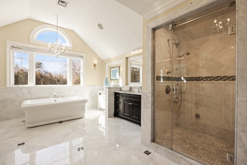 204 Cedar Street Lexington, MA 02421 - Photo 27 of 42 a bathroom with a tub shower and sink