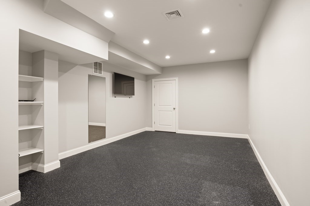 204 Cedar Street Lexington, MA 02421 - Photo 36 of 42 an empty room with closet and windows