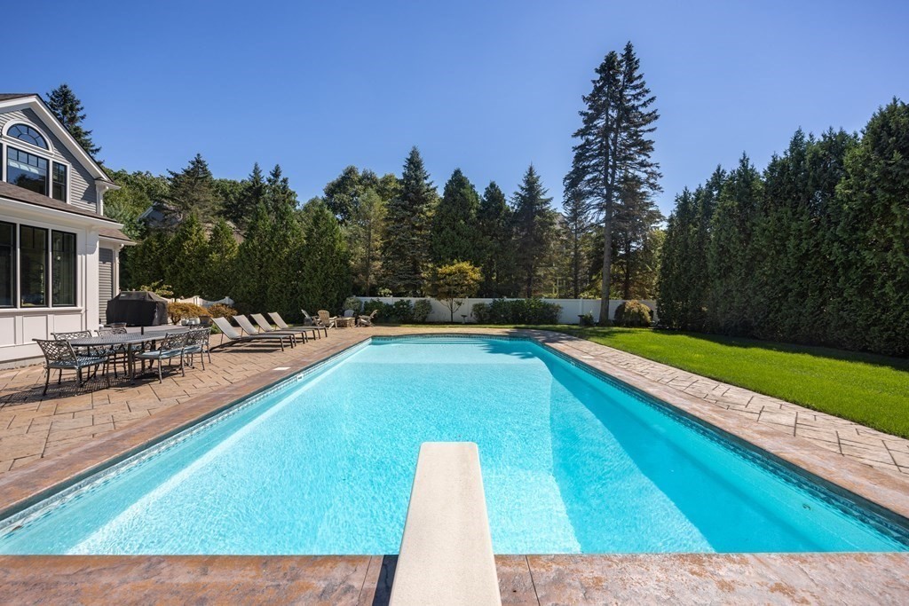 204 Cedar Street Lexington, MA 02421 - Photo 38 of 42 a swimming pool with outdoor seating and yard
