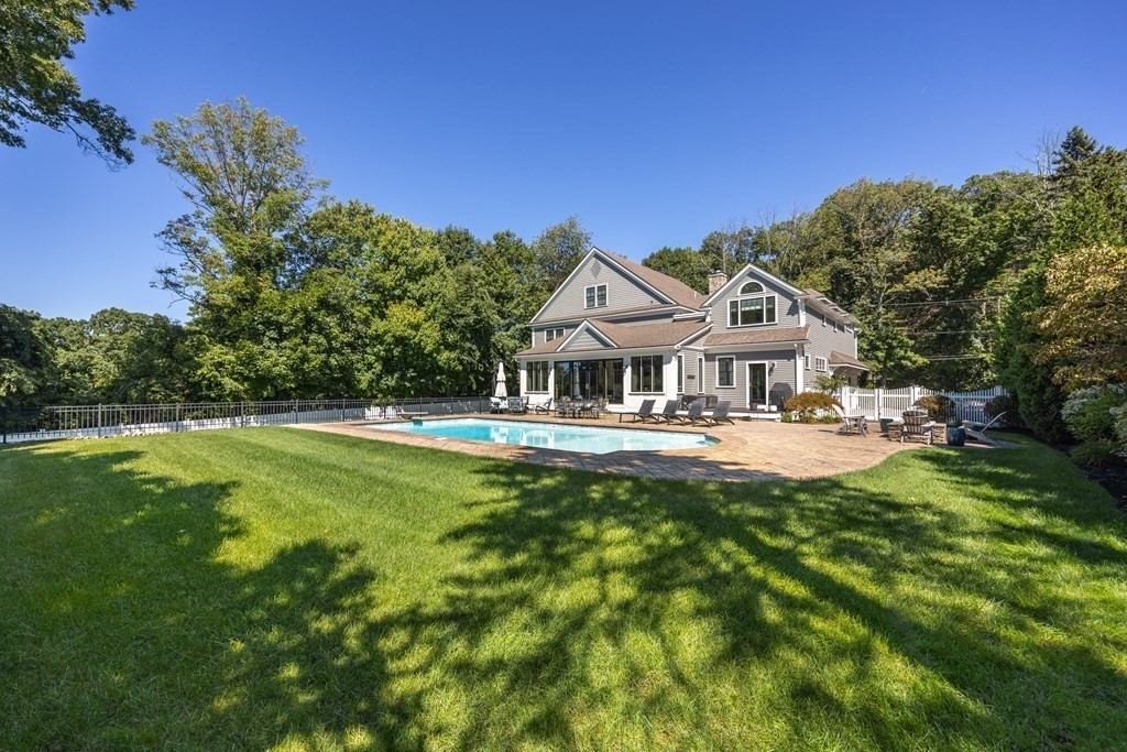 204 Cedar Street Lexington, MA 02421 - Photo 40 of 42 a front view of a house with yard and green space