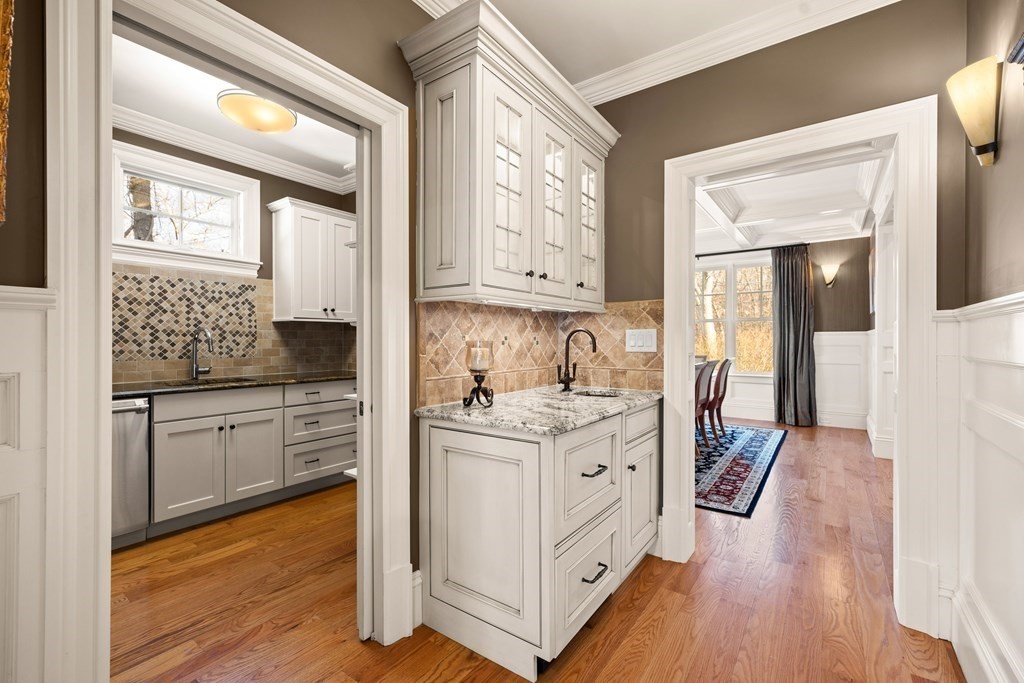 204 Cedar Street Lexington, MA 02421 - Photo 7 of 42 a kitchen with stainless steel appliances sink stove and wooden floor