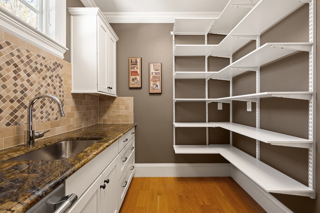 204 Cedar Street Lexington, MA 02421 - Photo 8 of 42 a kitchen with cabinets and window