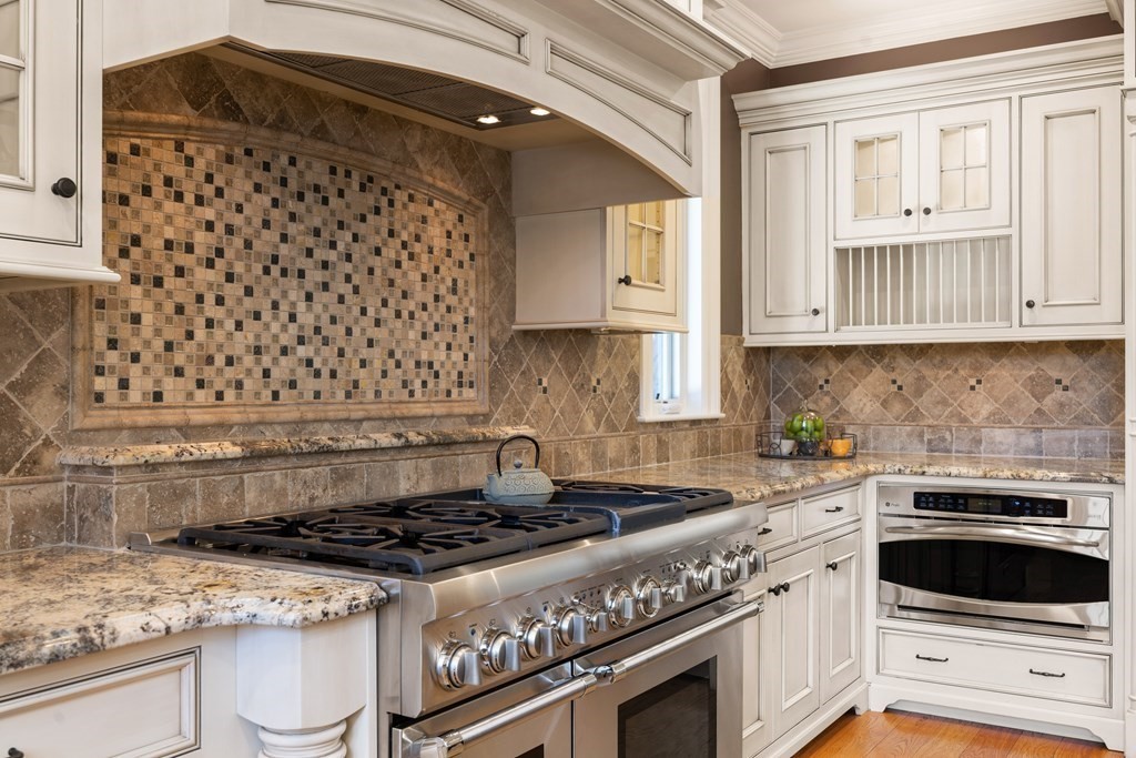 204 Cedar Street Lexington, MA 02421 - Photo 10 of 42 a white stove top oven sitting inside of a kitchen