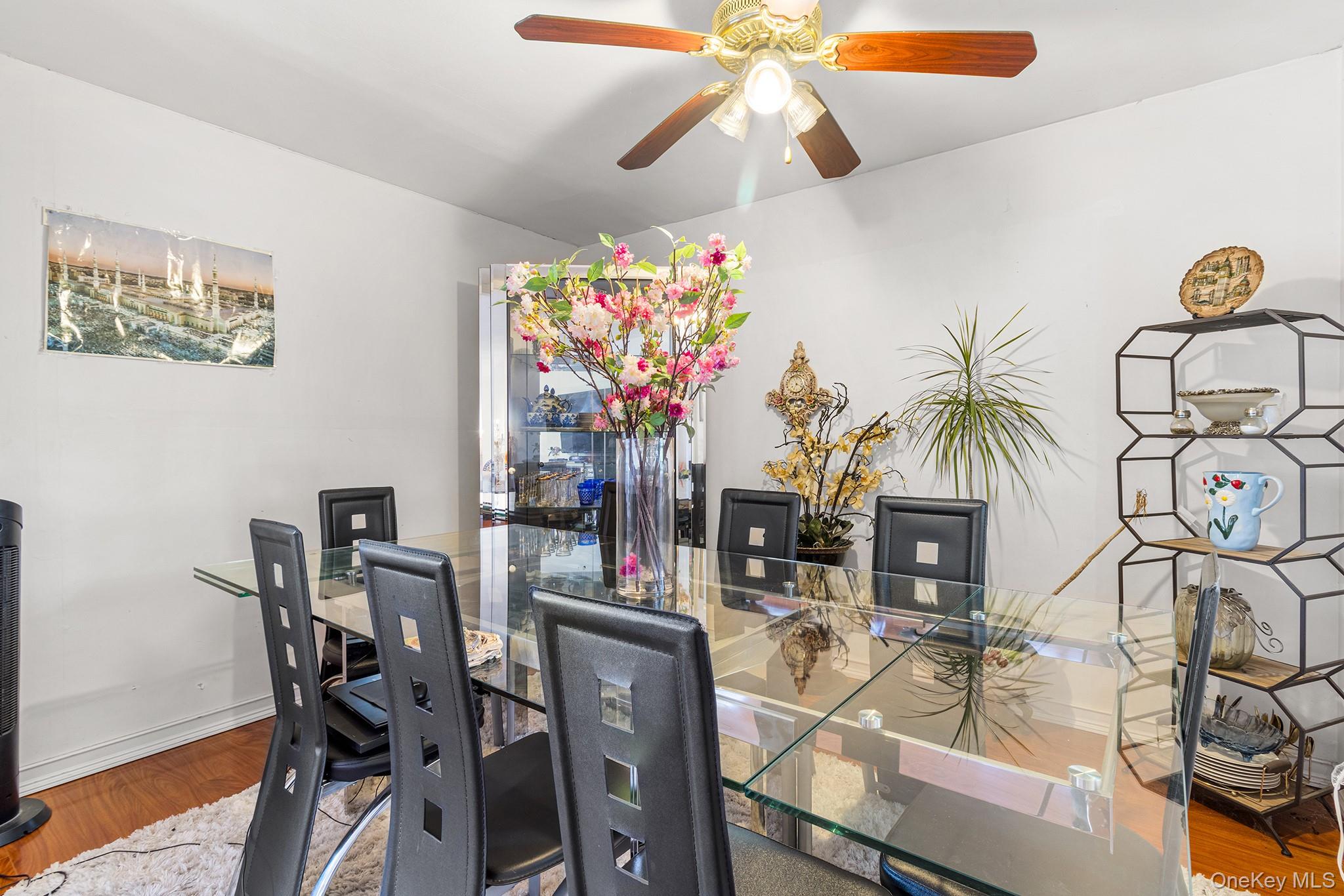 31 Holbrook Road Centereach, NY 11720 - Photo 12 of 27 a view of a dining room with furniture and chandelier