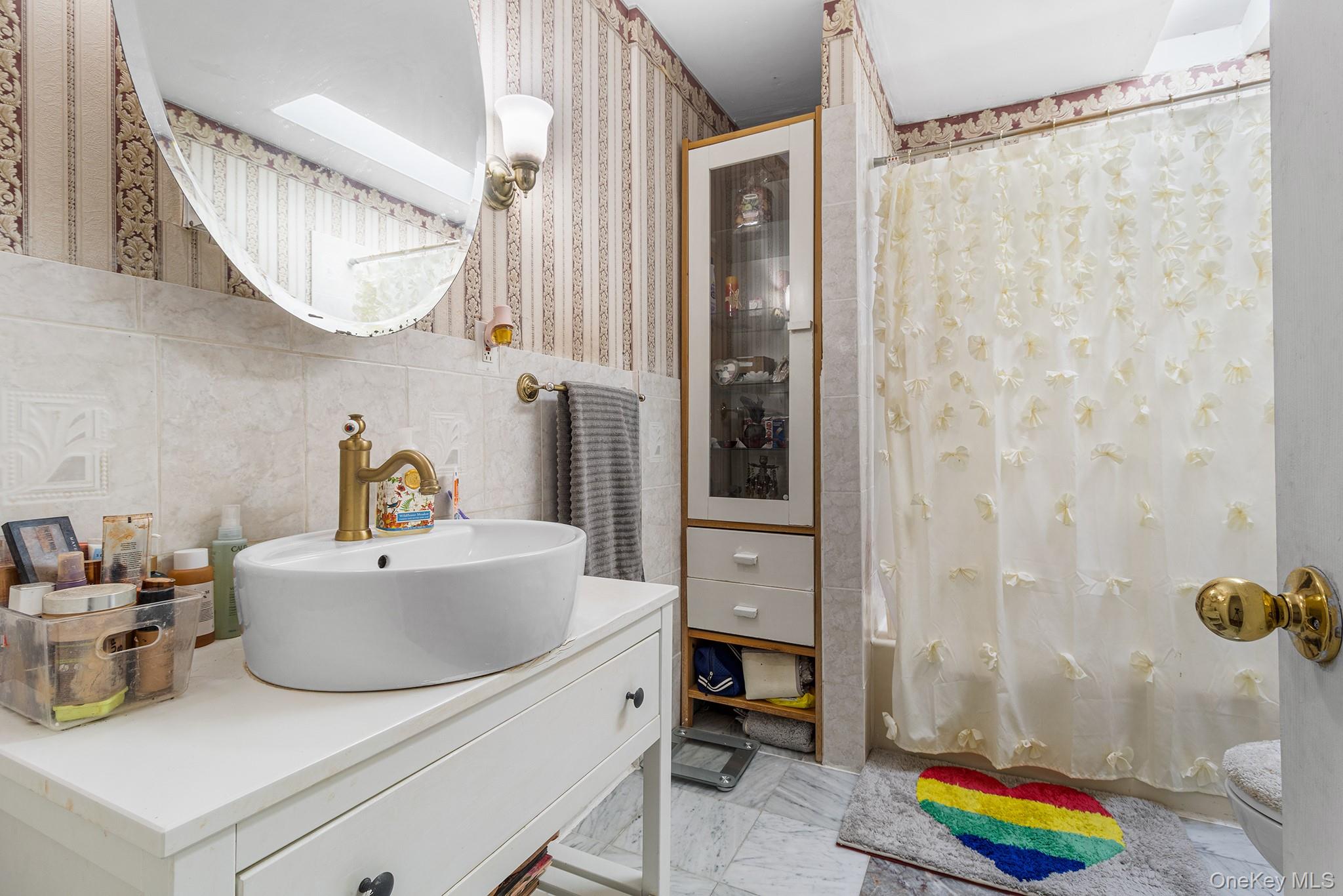 31 Holbrook Road Centereach, NY 11720 - Photo 16 of 27 a bathroom with a sink toilet and shower