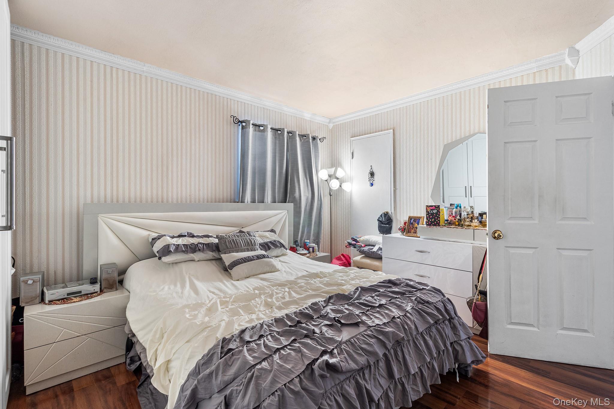 31 Holbrook Road Centereach, NY 11720 - Photo 18 of 27 a bedroom with a bed and a mirror