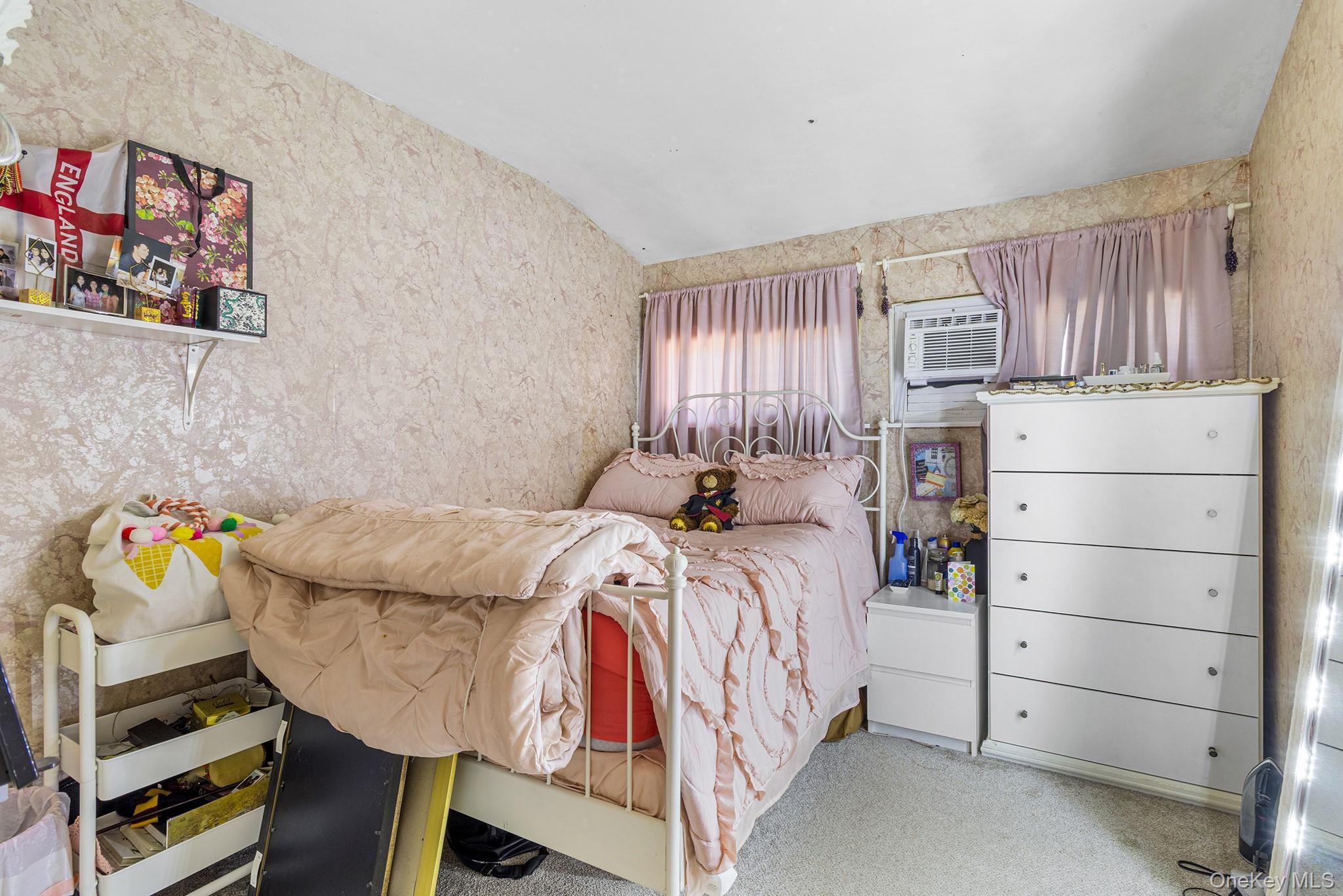 31 Holbrook Road Centereach, NY 11720 - Photo 21 of 27 a bedroom with a bed and a window