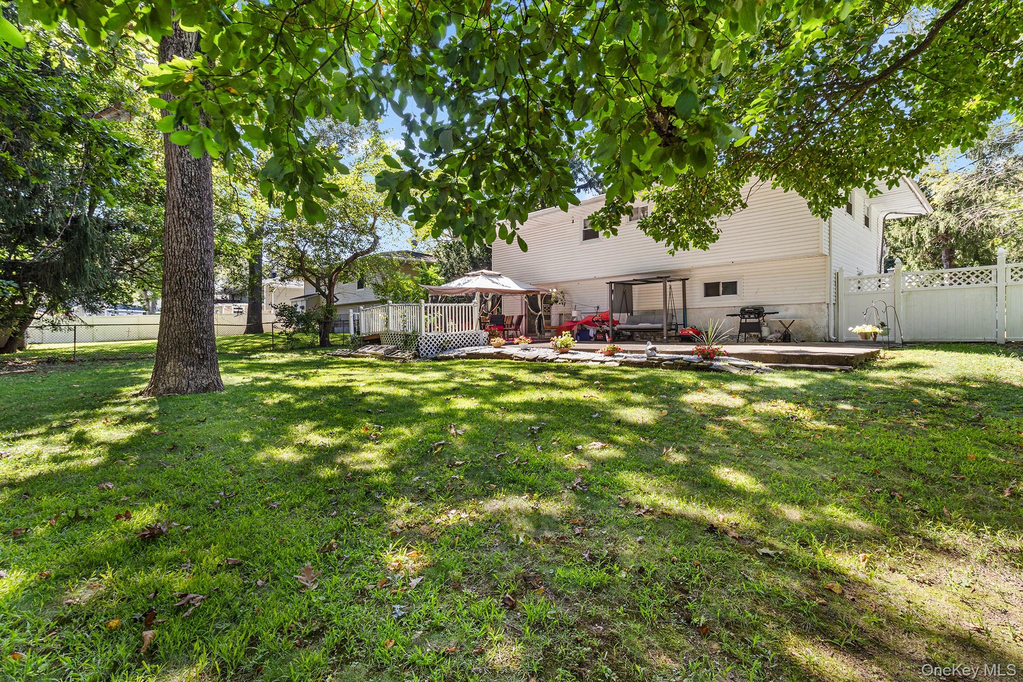 31 Holbrook Road Centereach, NY 11720 - Photo 25 of 27 a house view with a sitting space and garden view