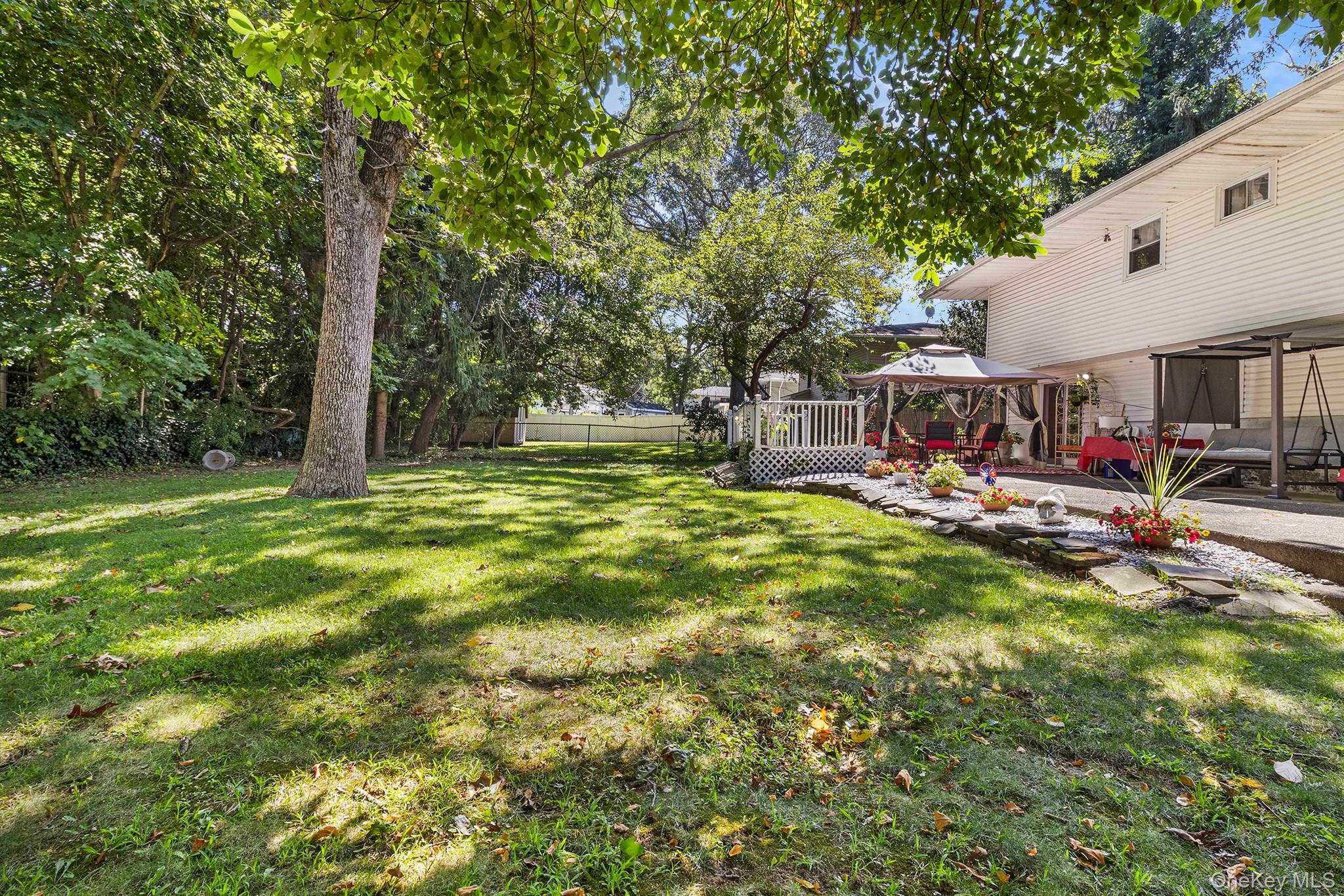 31 Holbrook Road Centereach, NY 11720 - Photo 26 of 27 a view of outdoor space with garden and trees