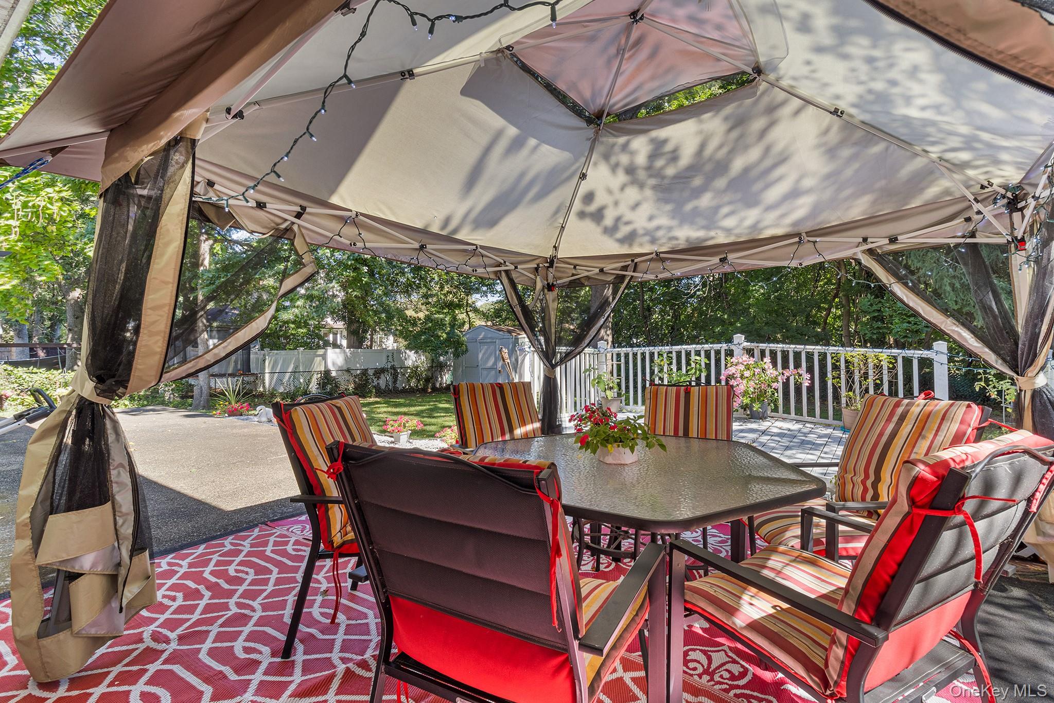 31 Holbrook Road Centereach, NY 11720 - Photo 27 of 27 a view of a chairs and table in the patio