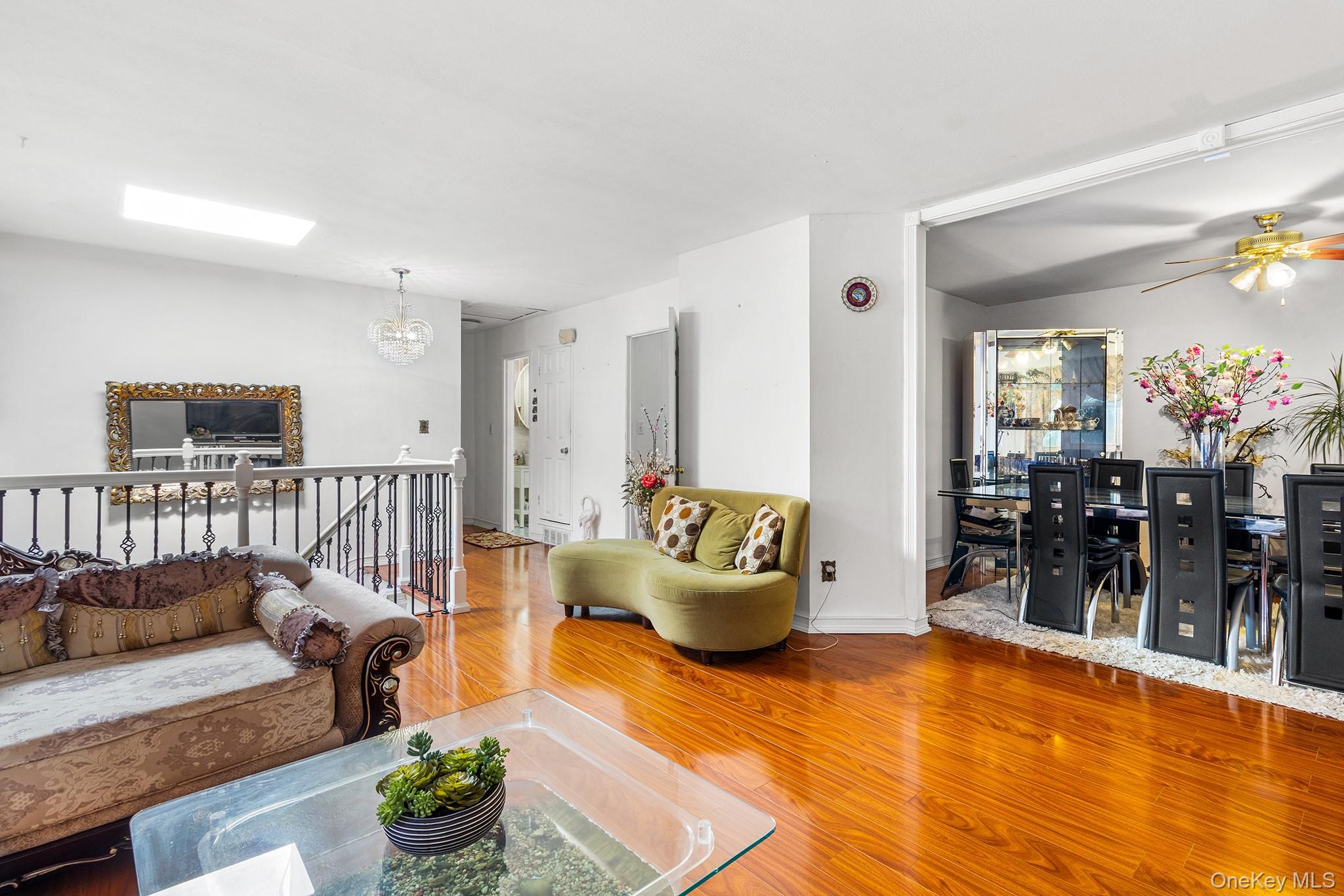 31 Holbrook Road Centereach, NY 11720 - Photo 10 of 27 a living room with furniture and wooden floor
