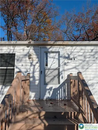 a view of a brick house with a large window