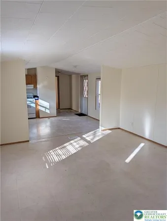 a view of a livingroom and a fireplace