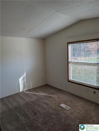 a view of a room that has a window