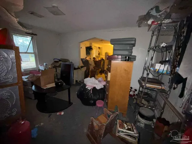 a room with gym equipment and a mirror