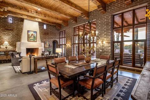a view of a dining room with furniture window and outside view