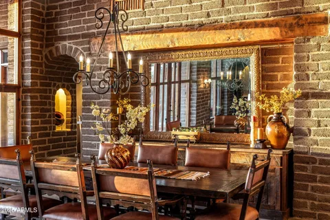 a view of a patio with table and chairs and potted plants