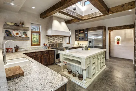 a view of a patio with table and chairs and potted plants