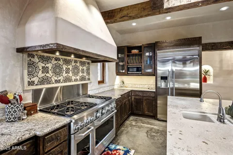 a kitchen with a stove and a sink