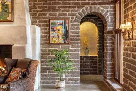 a living room with furniture window and wooden floor