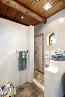 a en suite bathroom with double sink and a mirror