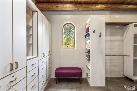 a bedroom with a bed and utility room