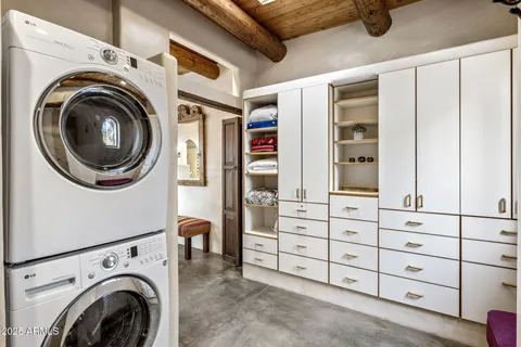a bathroom with a bathtub and a window