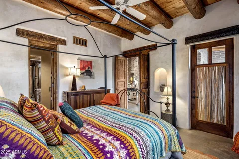 a bed room with furniture and a window